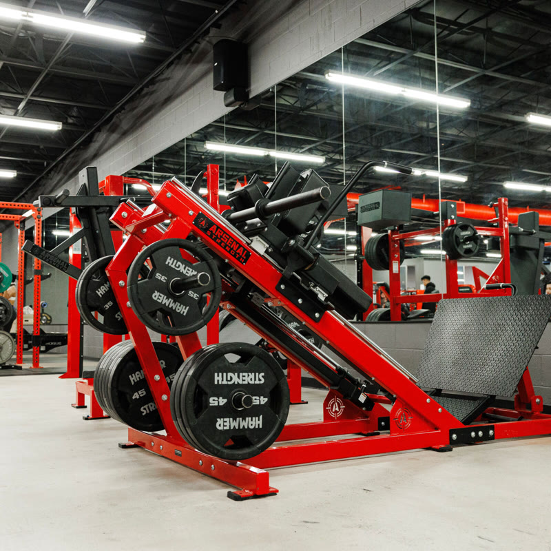 Loaded hack squat machine on the House of Gains floor