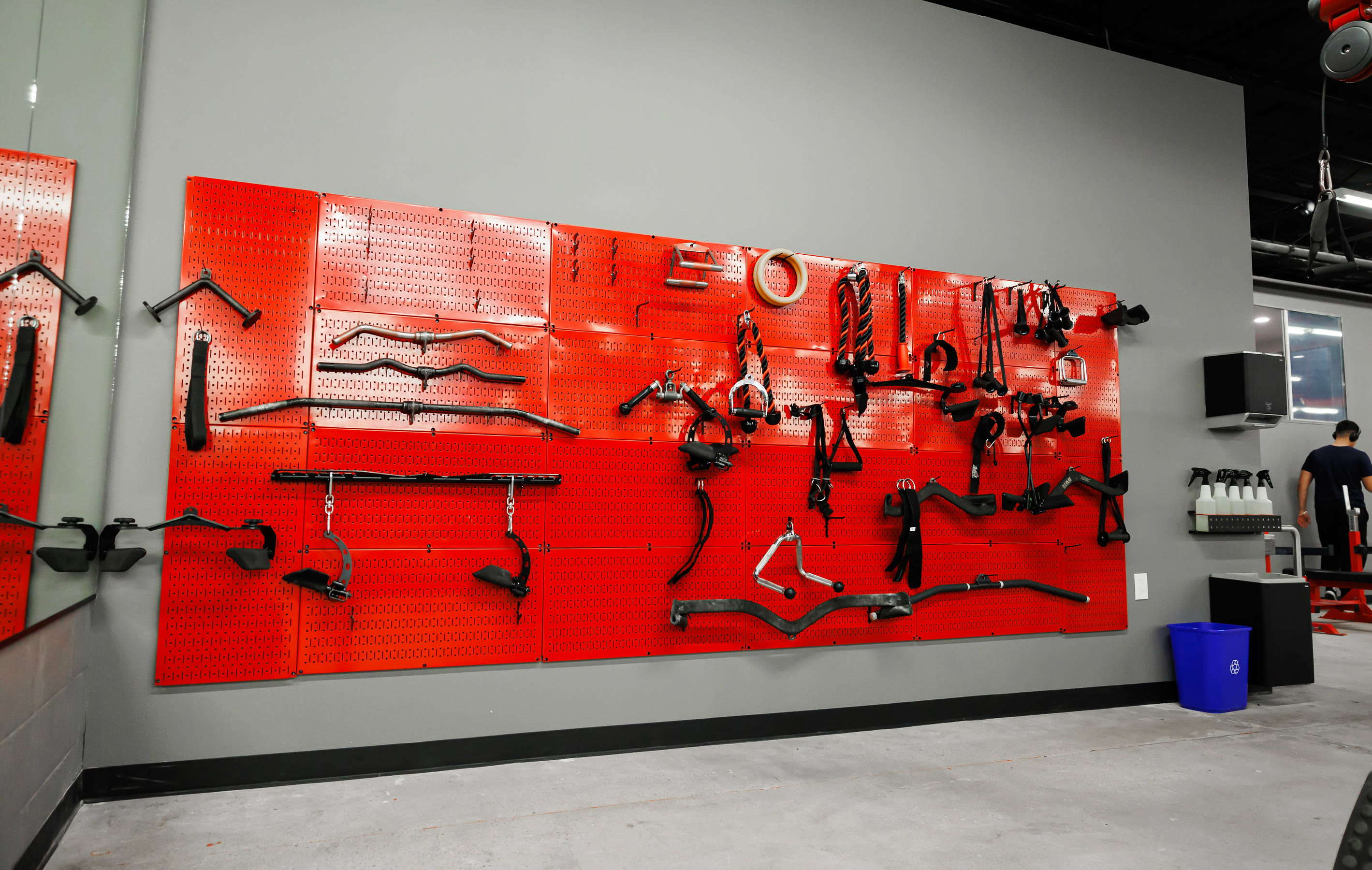 The red bar wall at Oxnard — specialty bars and attachments racked in rows
